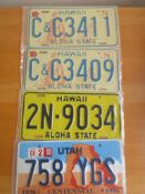 Four assorted decorative metal American Car Number Plates