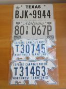 Four assorted decorative metal American Car Number Plates