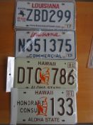 Four assorted decorative metal American Car Number Plates