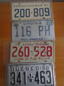 Four assorted decorative metal American Car Number Plates