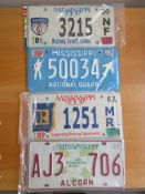 Four assorted decorative metal American Car Number Plates