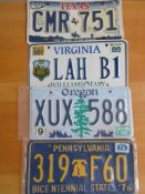 Four assorted decorative metal American Car Number Plates