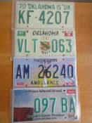 Four assorted decorative metal American Car Number Plates