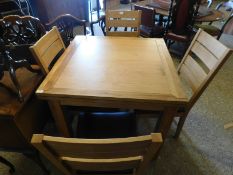 GOOD QUALITY OAK DRAWER LEAF DINING TABLE WITH FOUR BAR BACK DINING CHAIRS WITH LEATHERETTE