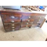 GOOD QUALITY OAK FRAMED HABERDASHERY OR SHOP CABINET FITTED WITH FIFTEEN DRAWERS (3 MISSING) WITH