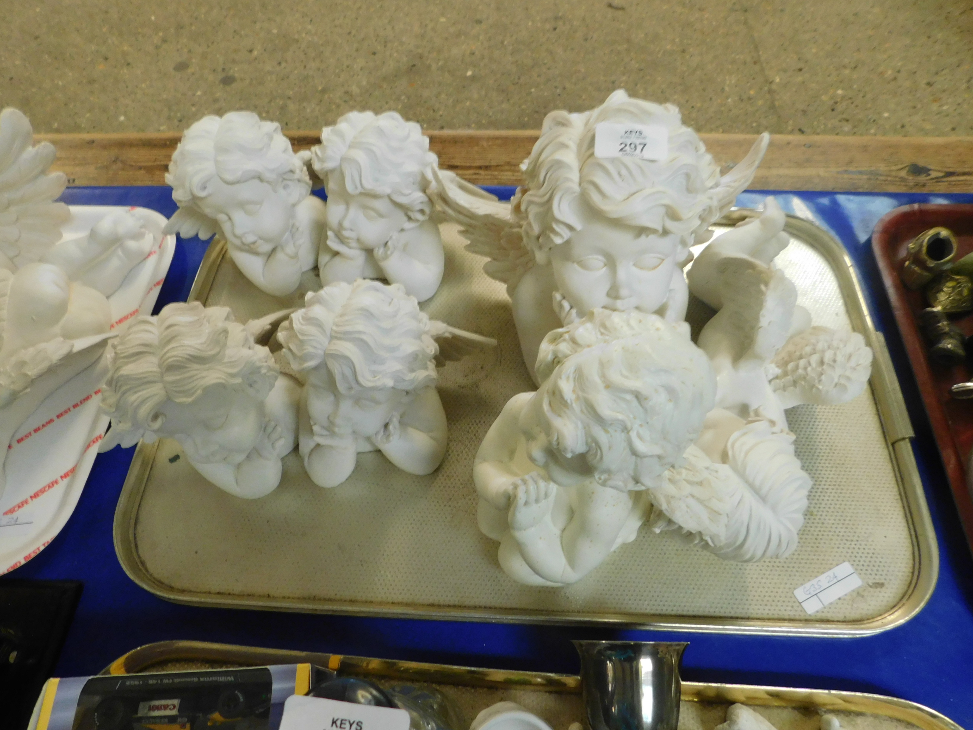 TRAY OF SEVEN PLASTER WORK PUTAI ORNAMENTS