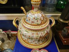 20TH CENTURY ITALIAN POTTERY COVERED TWO-HANDLED SOUP TUREEN AND STAND, WITH LADLE, 33CM HIGH