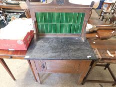 MARBLE TOP GREEN TILED BACK WASH STAND WITH SINGLE CUPBOARD DOOR ON TAPERING SQUARE LEGS