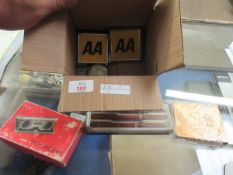 TWO 70S AA BADGES, BOXED PEN SET, BASE METAL STAMP CASE AND A NICKEL COMPASS