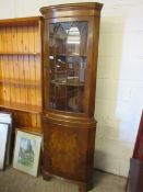 WALNUT FRAMED FLOOR STANDING CORNER CUPBOARD WITH GLAZED AND PANELLED DOOR