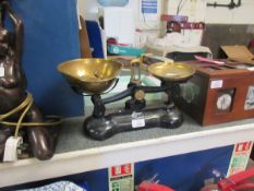 CAST IRON SET OF SCALES WITH BRASS TRAYS AND BELL WEIGHTS