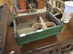 EASTERN HARDWOOD GREEN PAINTED AND CARVED TROUGH WITH FINIAL SUPPORTS TOGETHER WITH A FURTHER DOUBLE
