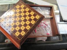 MAHOGANY CASED SLIDE TOP TRAVELLING CHESS SET WITH A QUANTITY OF STAINED BONE CHESS PIECES