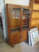 MID-20TH CENTURY OAK FRAMED BOOKCASE WITH TWO GLAZED DOORS OVER TWO PANELLED CUPBOARD DOORS