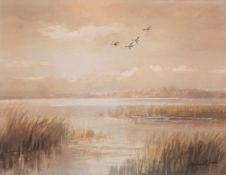 AR Roland Green (1896-1972), Ducks in flight over an estuary, watercolour, signed lower right, 26
