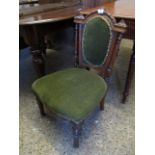 VICTORIAN NURSING CHAIR, GREEN UPHOLSTERED BACK AND SEAT, ARCHED TOP WITH CARVED DETAIL, FLANKED