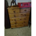 STAINED PINE FRAMED CHEST OF TWO OVER FOUR FULL WIDTH DRAWERS AND TURNED KNOB HANDLES