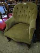 VICTORIAN MUSHROOM UPHOLSTERED BUTTON BACK ARMCHAIR WITH TURNED FRONT LEGS AND RAISED ON PORCELAIN