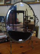 BRASS FRAMED OVAL MIRROR WITH BEVELLED GLASS AND SIDE HANDLES