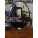 BRASS FRAMED OVAL MIRROR WITH BEVELLED GLASS AND SIDE HANDLES