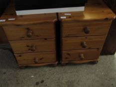 PAIR OF STAINED PINE FRAMED THREE DRAWER BEDSIDE CHESTS ON BUN FEET