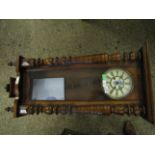 EARLY 20TH CENTURY WALNUT CASED VIENNA TYPE WALL CLOCK WITH OVERHANGING CORNICE AND BALUSTER