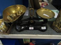 CAST IRON SET OF SCALES WITH BRASS TRAYS AND BELL WEIGHTS