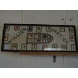 FRAMED COLLECTION OF CIGARETTE CARDS SEWN ONTO A COTTON BACKGROUND AND DETAILED WILLIE'S MATCH IN