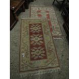 PAIR OF CREAM AND CORAL GEOMETRIC DESIGN FLOOR RUGS