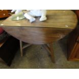 ELM ERCOL CIRCULAR DROP LEAF TABLE WITH SPLAYED LEGS AND SUPPORTED BY AN X STRETCHER