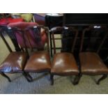 FOUR EDWARDIAN MAHOGANY PIERCED SPLAT BACK DINNING CHAIRS WITH BROWN LEATHER UPHOLSTERED SEATS AND