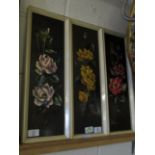 THREE FRAMED OILS ON PANELS OF FLOWERS