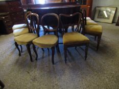 SET OF FOUR ROSEWOOD BALLOON BACK DINNING CHAIRS WITH CARVED BACK RAIL AND YELLOW DROP IN SEATS