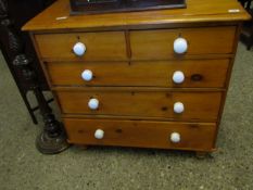 VICTORIAN STAINED PINE TWO OVER THREE FULL WIDTH DRAWER CHEST WITH WHITE PORCELAIN HANDLES RAISED ON