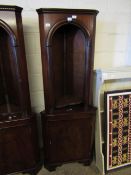 REPRODUCTION MAHOGANY CORNER CABINET WITH ARCHED TOP AND OPEN SHELVES OVER PANELLED DOOR