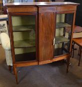 Edwardian inlaid mahogany display cabinet of break fronted bow front form, two opening glass