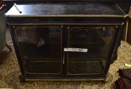 Victorian ebonised and ormolu mounted display cabinet of canted rectangular form, two glass doors to