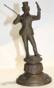 Victorian cast brass Dickensian figure holding a bottle and walking cane (replacement) on decorative