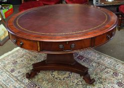 Reproduction mahogany pedestal drum table of circular form, four opening oak lined drawers and