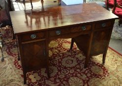 Early 20th century mahogany desk/dressing table with polished rectangular top, a drawer and a door
