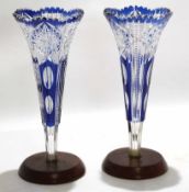 Pair of cut glass Bohemian style vases, both with wooden mounts, the tapered body with cut glass