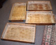 Set of four vintage pine and metal banded trays of rectangular form, bear traces of manufacturer/