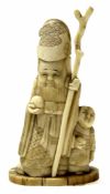 Early 20th century ivory model of an immortal, probably Shou Lao, 10cm high