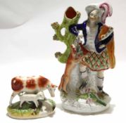 Large Staffordshire figure of a Scotsman with a hunting dog, together with a smaller Staffordshire