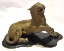 Good quality resin model of a tiger with jaw wide open and paw raised, on an ebonised shaped