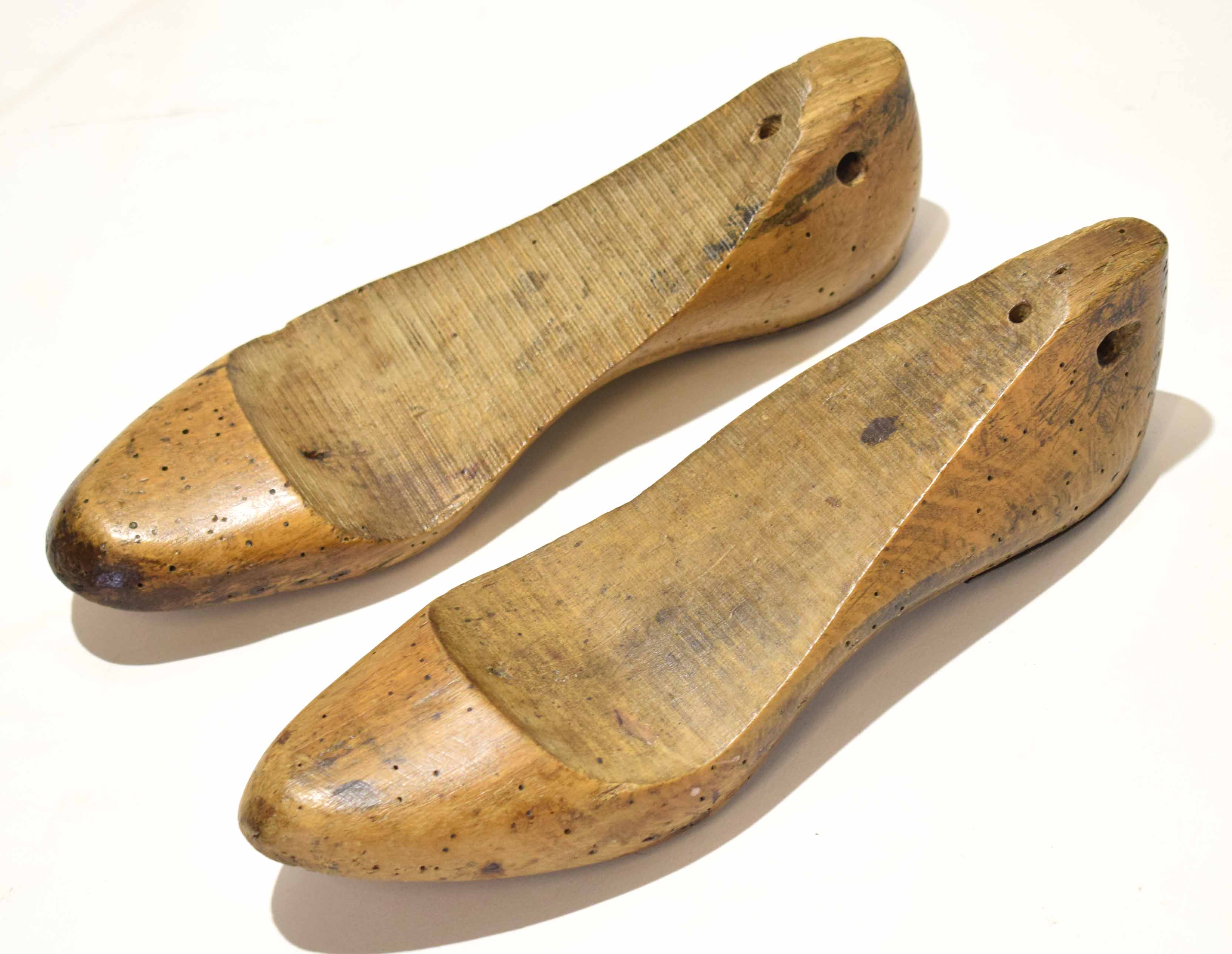 Pair of antique shaped treen and iron mounted shoe lasts, (2)