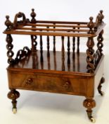 Victorian walnut Canterbury with carved and open top handles, with finials to each corner,
