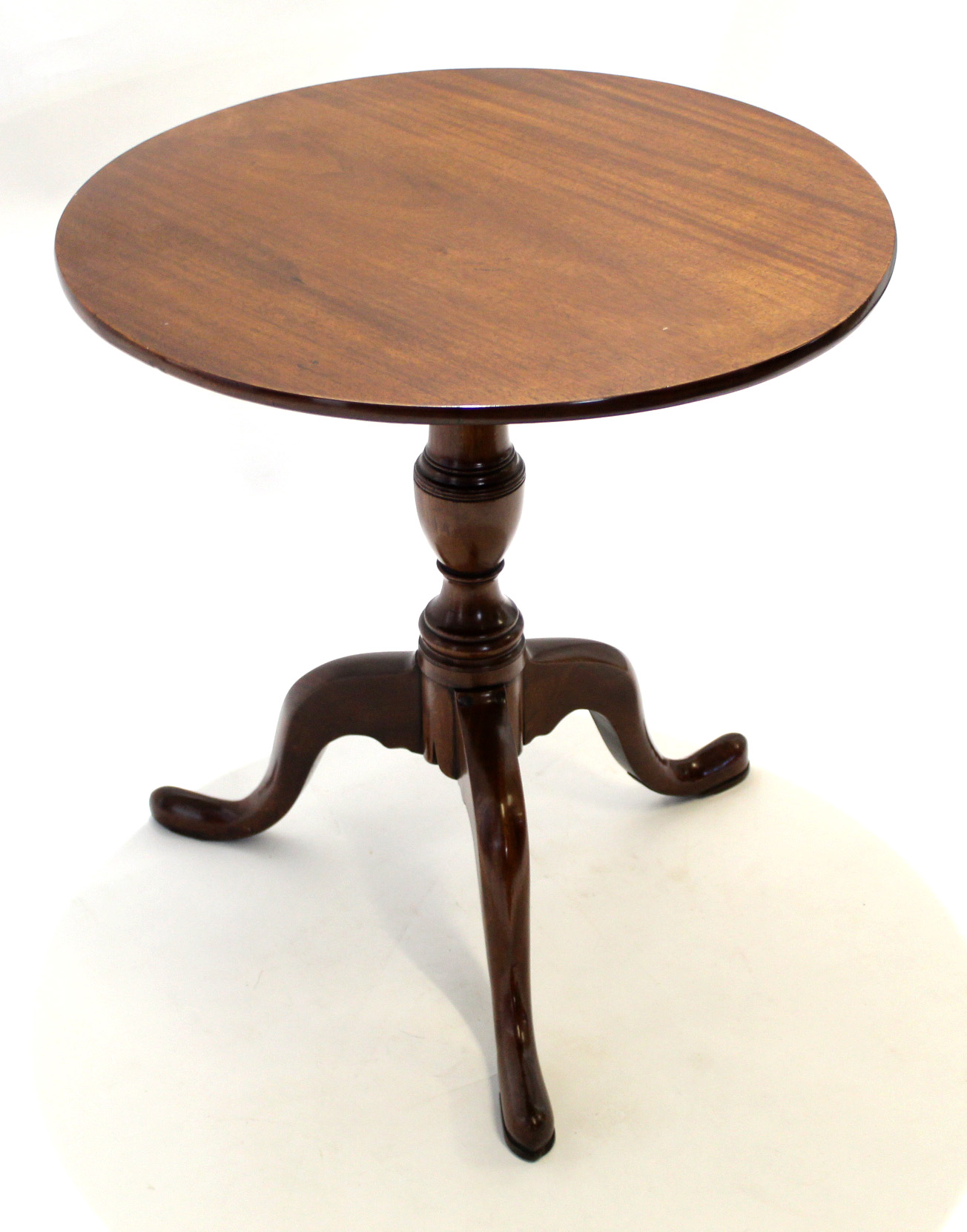 19th century mahogany circular top tilt top table with turned column on a splayed tripod base,