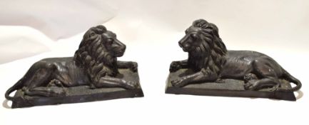 Pair of 20th century cast hollow bronze models of recumbent lions, 53cm long (max) x 21cm deep x