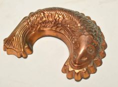 Late 20th century copper jelly or blancmange mould in the form of a curled fish, 26cm x 18cm (max)